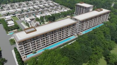 Aerial view of a modern apartment complex surrounded by greenery