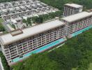 Aerial view of a modern apartment complex surrounded by greenery