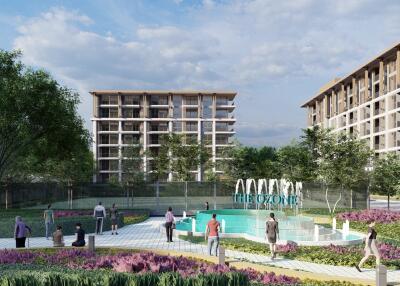 Photo of modern apartment buildings with a fountain and landscaped garden area.