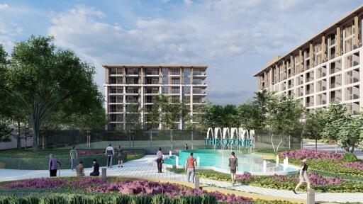 Photo of modern apartment buildings with a fountain and landscaped garden area.