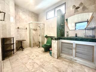 Spacious bathroom with separate shower and vanity area