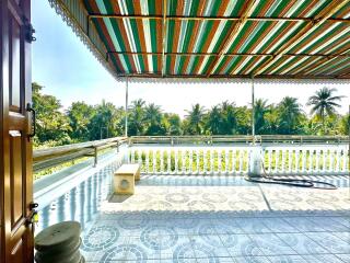 Spacious balcony with tiled floor and scenic view