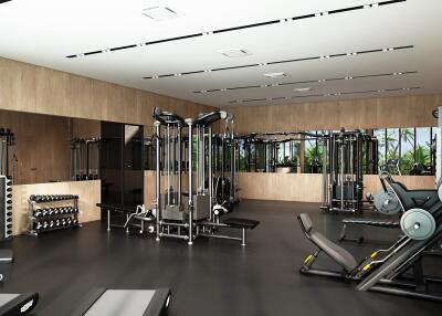 Well-equipped gym with various exercise machines and weights