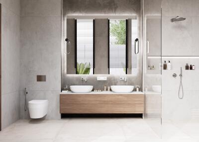 Modern bathroom with floating vanity, dual sinks, and walk-in shower