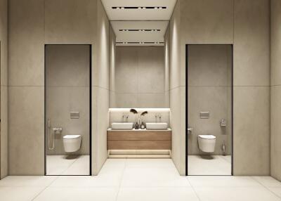 Modern twin bathroom with beige tiles and dual toilets