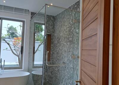 Modern bathroom with a glass shower and standalone bathtub