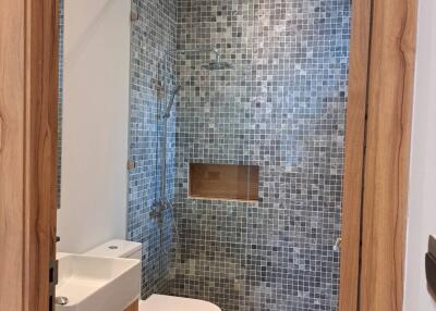 Modern bathroom with mosaic tiled shower