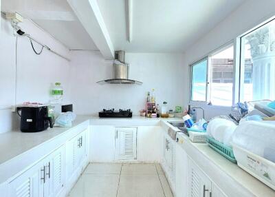 Bright kitchen with white cabinets and modern appliances