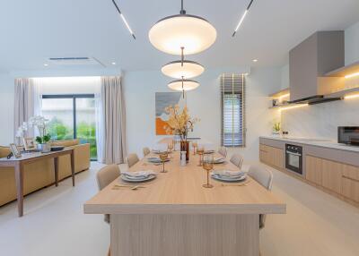 Modern dining room with a large wooden table and stylish lighting