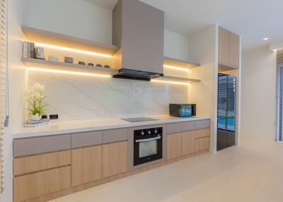 Modern kitchen with wooden cabinets and built-in appliances