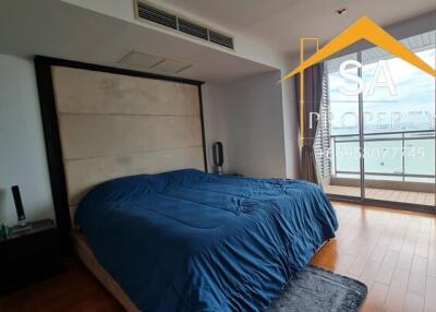 Spacious bedroom with large window and sea view