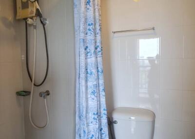 Small bathroom with shower and toilet