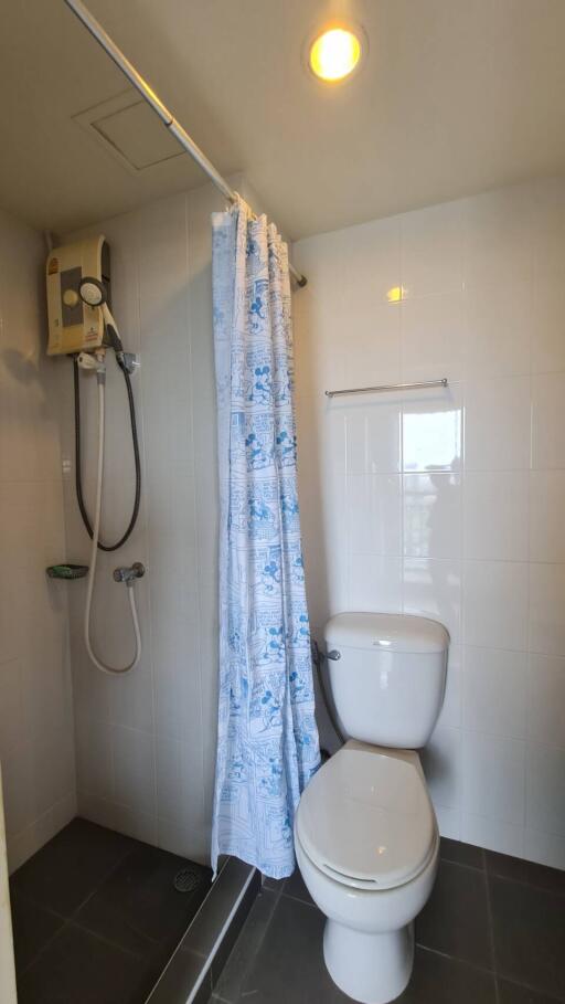 Small bathroom with shower and toilet