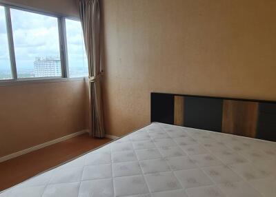 Bedroom with large window and view