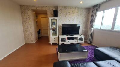 Living room with entertainment unit and window view