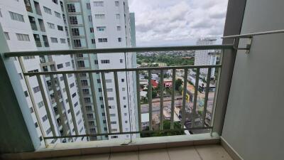 View from balcony overlooking buildings and city landscape