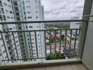 View from balcony overlooking buildings and city landscape