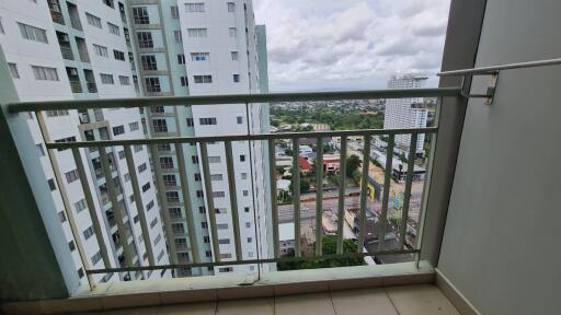 View from balcony overlooking buildings and city landscape