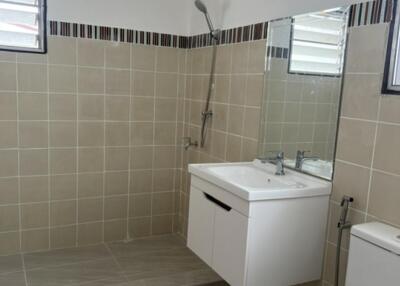 Modern bathroom with tiled walls