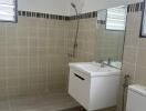 Modern bathroom with tiled walls