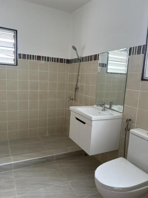 Modern bathroom with tiled walls