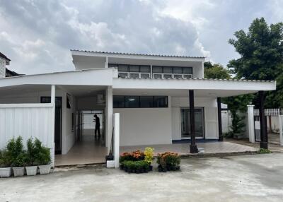 Front view of a contemporary house with a covered driveway