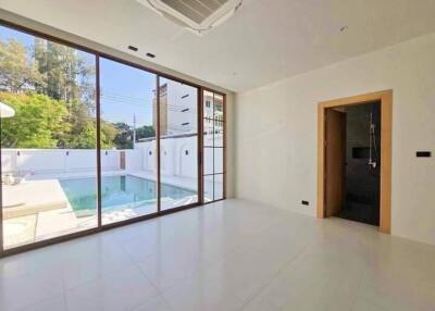 Modern living room with pool view