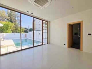 Modern living room with pool view