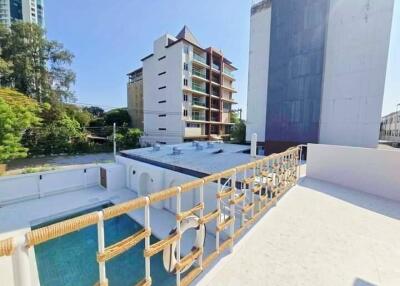 Rooftop view of a modern building with a swimming pool