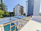 Rooftop view of a modern building with a swimming pool