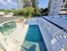 Outdoor area with swimming pool and modern architectural features