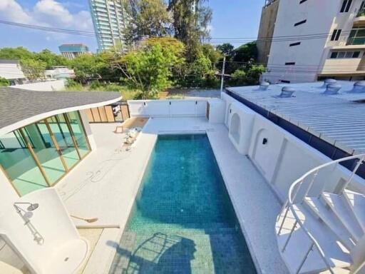 Outdoor area with swimming pool and modern architectural features