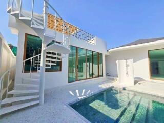 Modern building with outdoor pool and spiral staircase