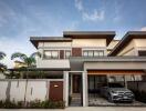 Modern two-story house with garage and a car in the driveway