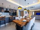 Modern open concept kitchen and living area with dining table