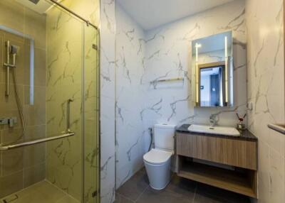 Modern bathroom with glass shower and floating vanity