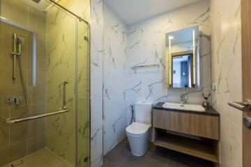 Modern bathroom with glass shower and floating vanity