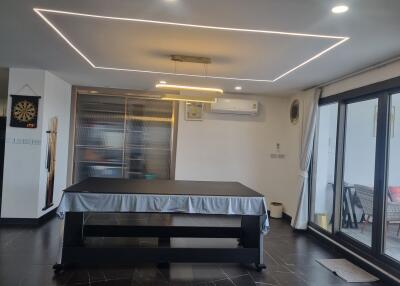 Modern game room with a pool table