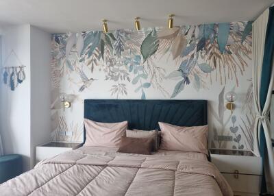 Modern bedroom with decorative wallpaper and stylish bedding