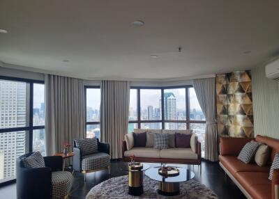 Modern living room with large windows and city view