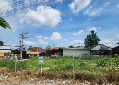 Vacant land plot with surrounding buildings