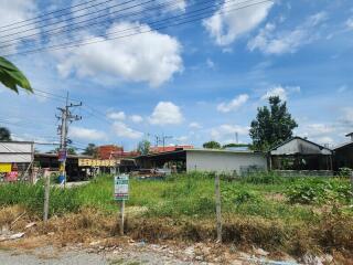 Vacant land plot with surrounding buildings