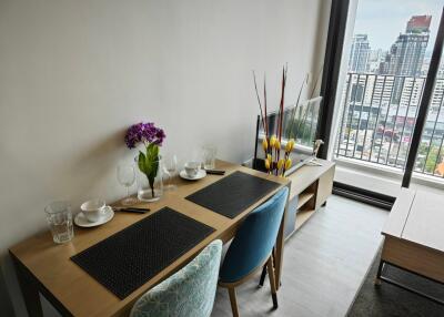 Modern dining area with table setup and city view