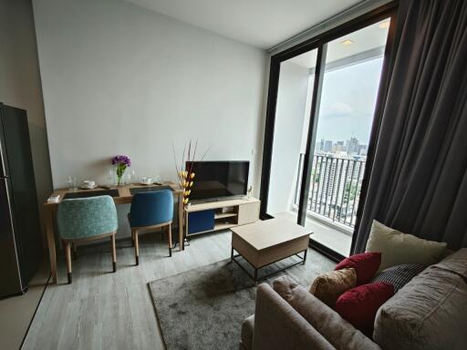 Modern living room with dining area and city view