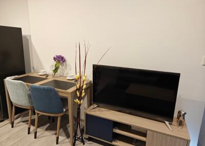 Living room with dining table and TV stand