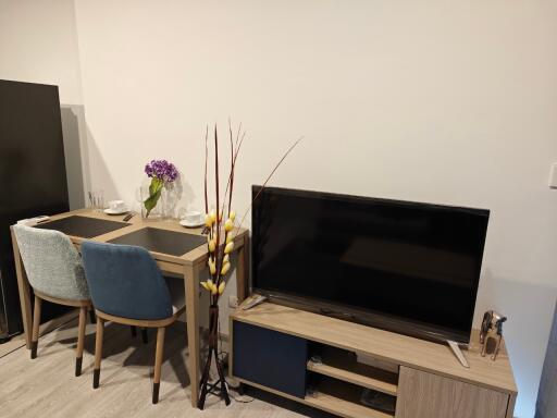 Living room with dining table and TV stand