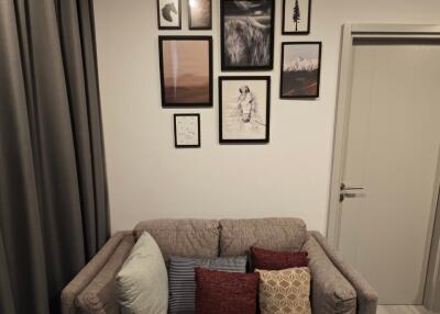 Cozy living area with decorative pillows and wall art