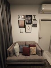 Cozy living area with decorative pillows and wall art