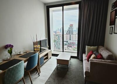 Modern living room with dining area and city view