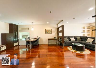 Spacious living room with dining area and modern furnishings